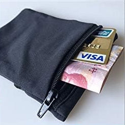 Black wrist wallet with money and a Visa card inserted into zip pocket