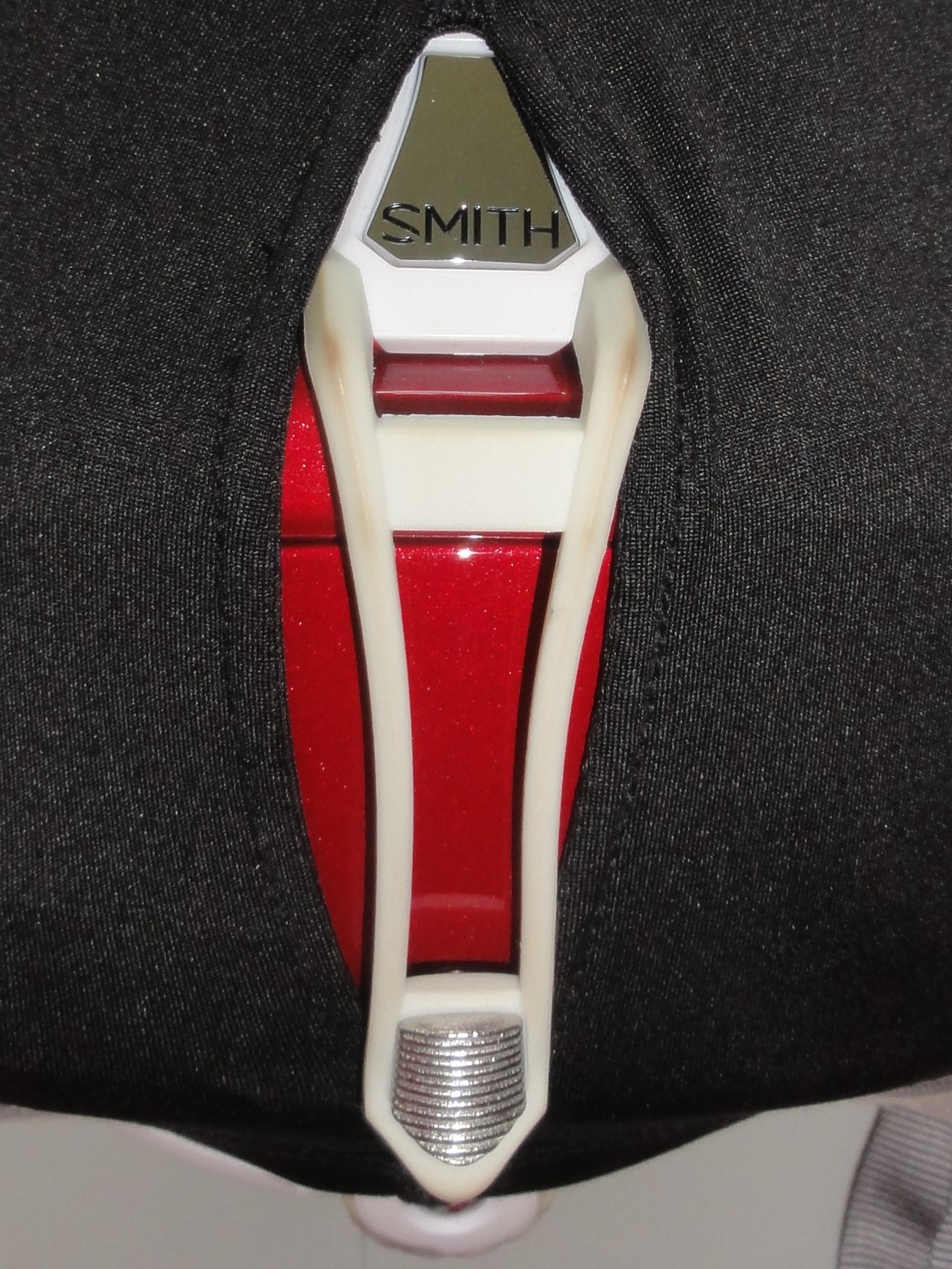 Close up of aperture for goggle retainer clip at the back of trixski Ski Helmet Cover