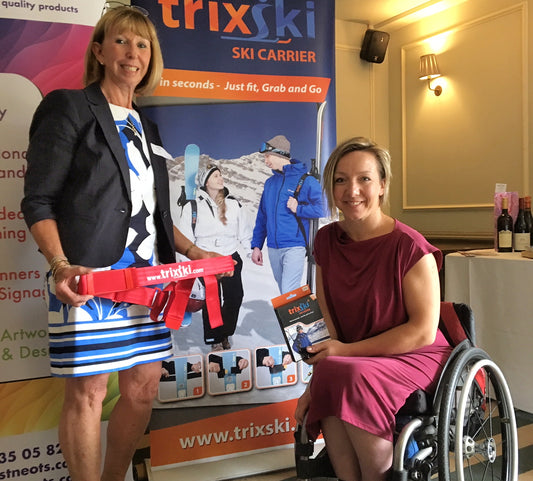 Tricia Blaxill and paralympian Anna Turney discussing the trixski Ski Carrier.  trixski retractable banner in the background.