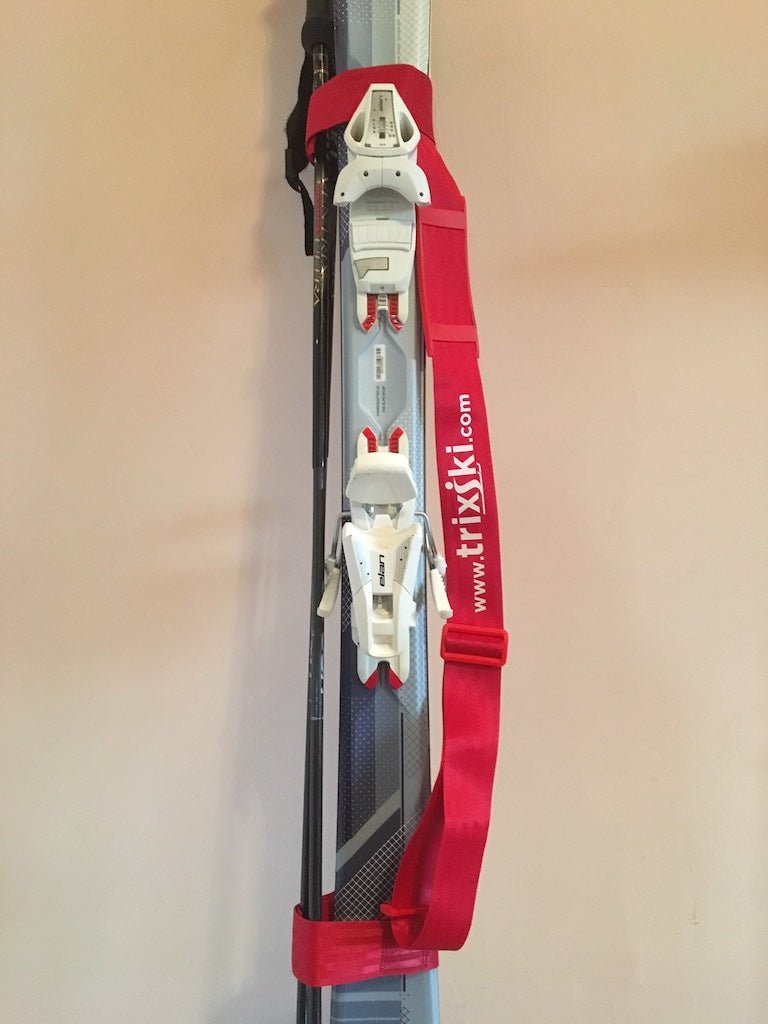 Red trixski Ski Carrier fitted on a pair of skis/poles