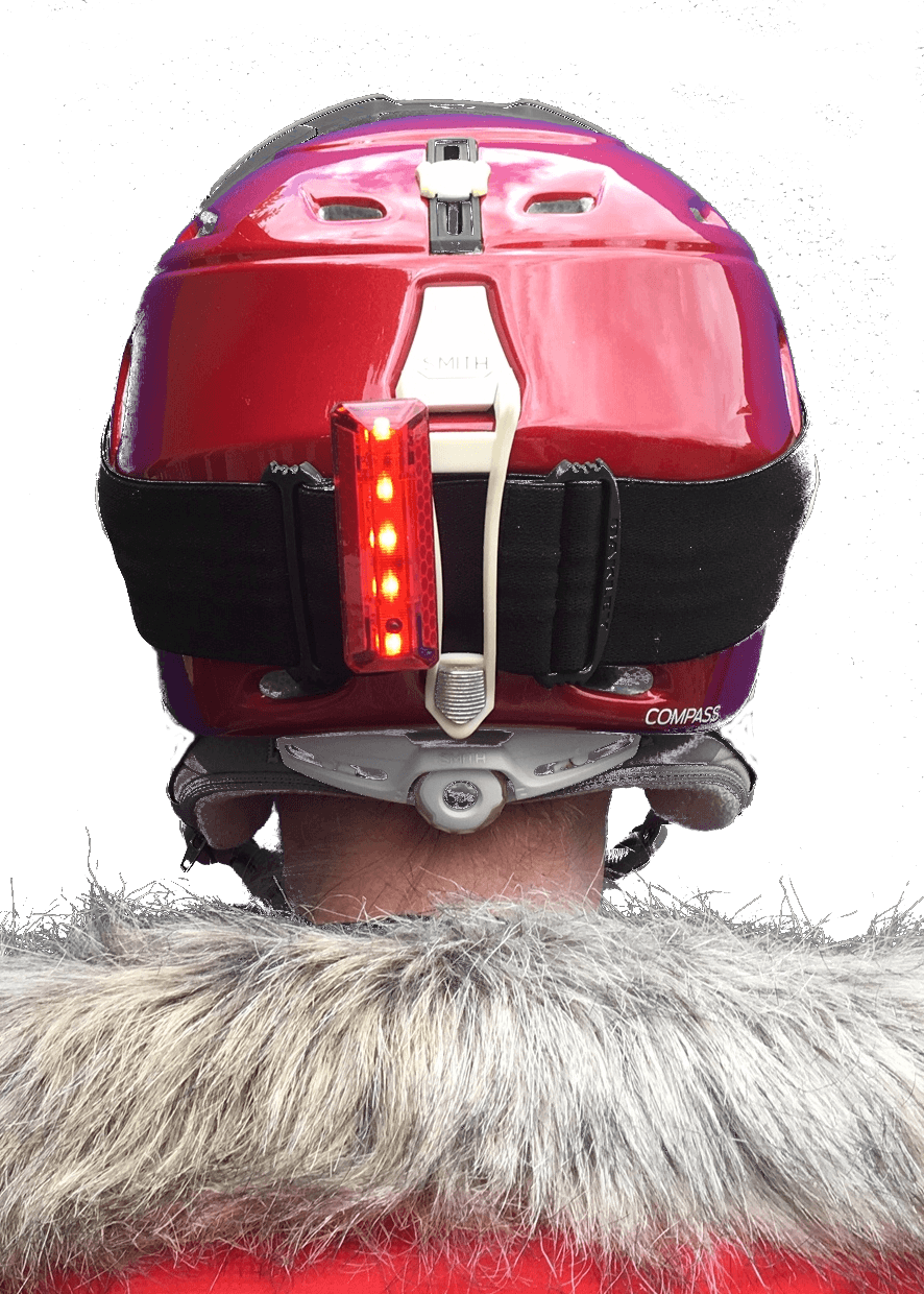 Close up of trixski LED Ski Helmet Light in use on the back of a ski helmet