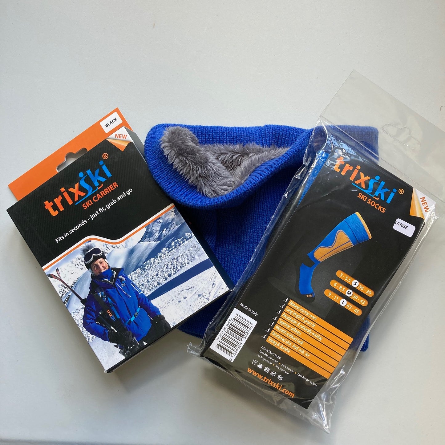 New skier's starter pack items: ski carrier, ski socks and neck warmer