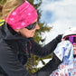 Adult polishing a child's goggles with a WipeOut microfibre Piste Map cloth
